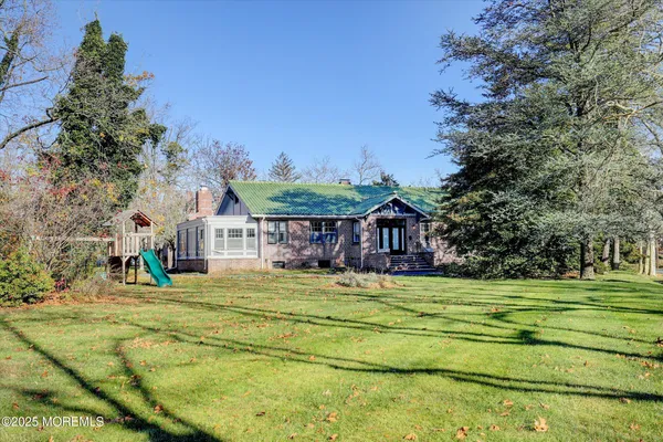 a view of a house with a big yard