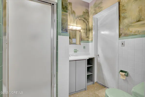 a bathroom with a sink and toilet