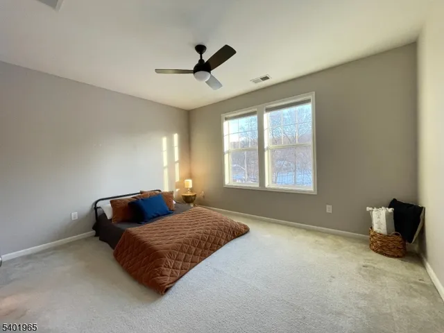a living room with couch and a window