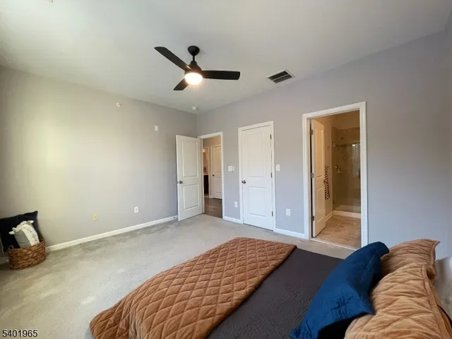 a bedroom with bed and a window