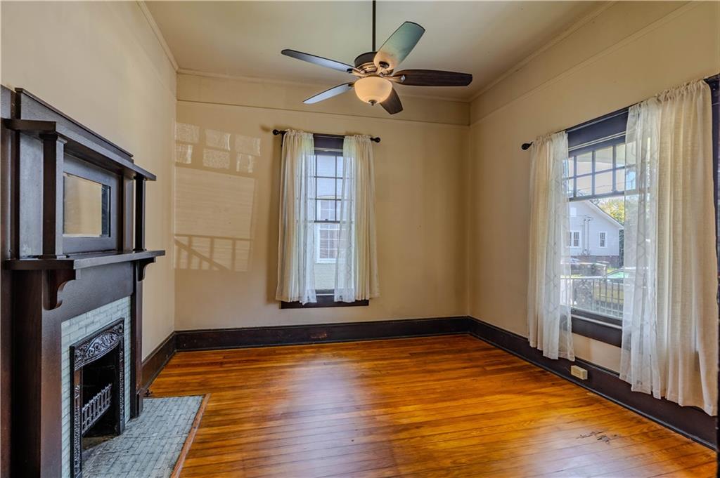 601 West 10th Street Rome, GA 30165 - Photo 8 of 25 wooden floor in an empty room with a fireplace