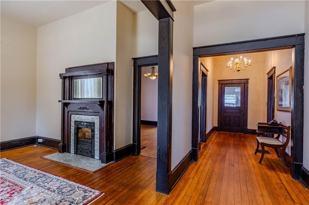 601 West 10th Street Rome, GA 30165 - Photo 9 of 25 a view of a hallway with wooden floor and staircase