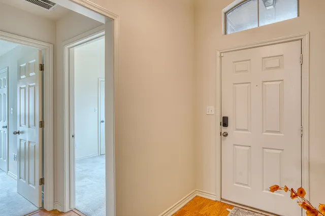 a view of a bathroom from a hallway