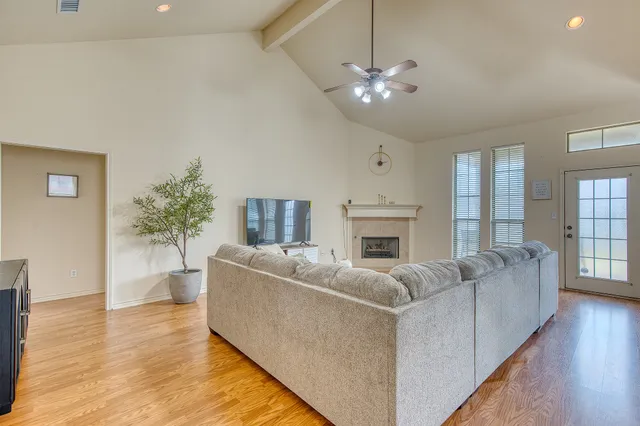 a living room with furniture and a fireplace