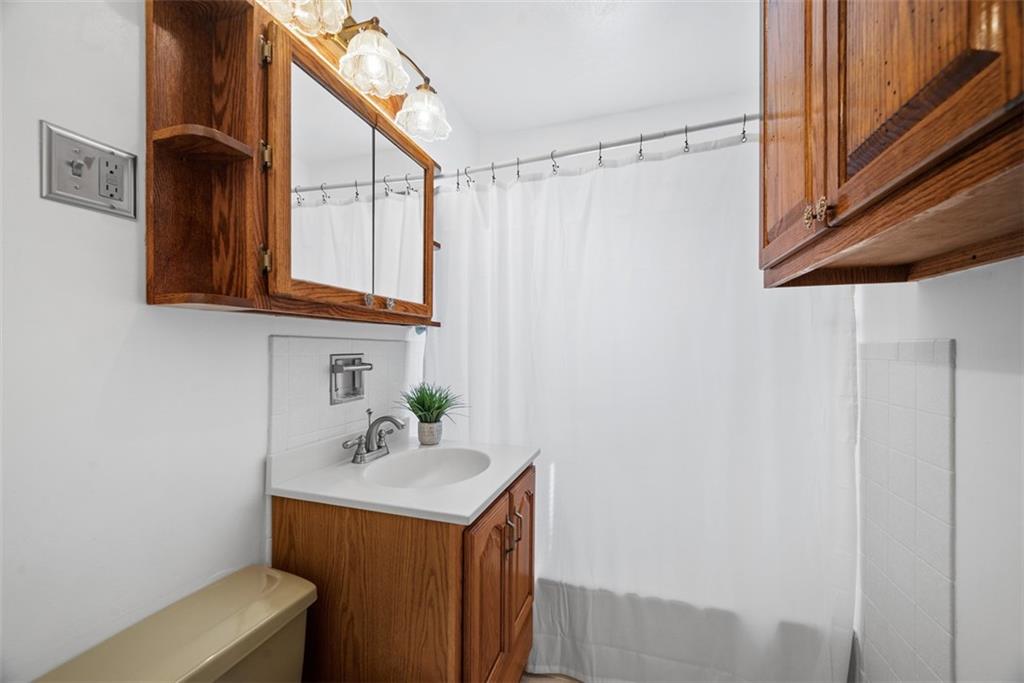 2812 Ridge Rd Extension Baden, PA 15005 - Photo 16 of 44 a bathroom with a sink and a mirror