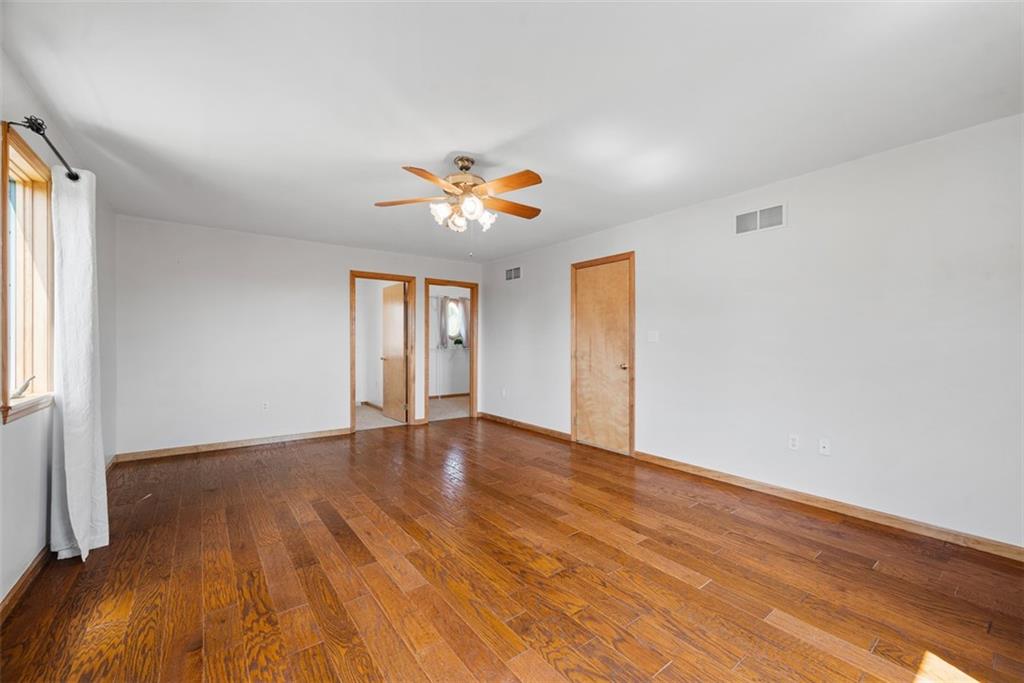 2812 Ridge Rd Extension Baden, PA 15005 - Photo 20 of 44 a view of an empty room with window and wooden floor