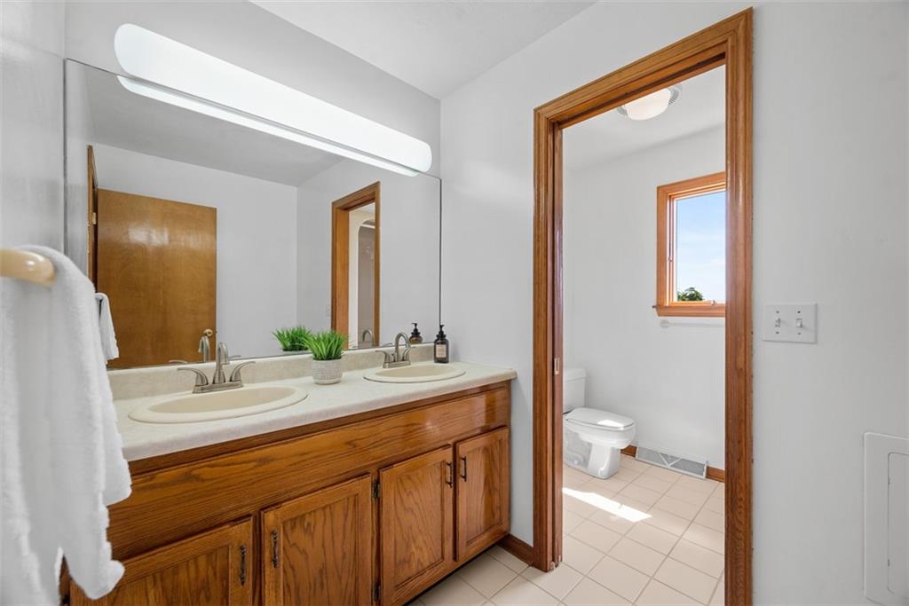 2812 Ridge Rd Extension Baden, PA 15005 - Photo 24 of 44 a bathroom with a sink a toilet and a mirror
