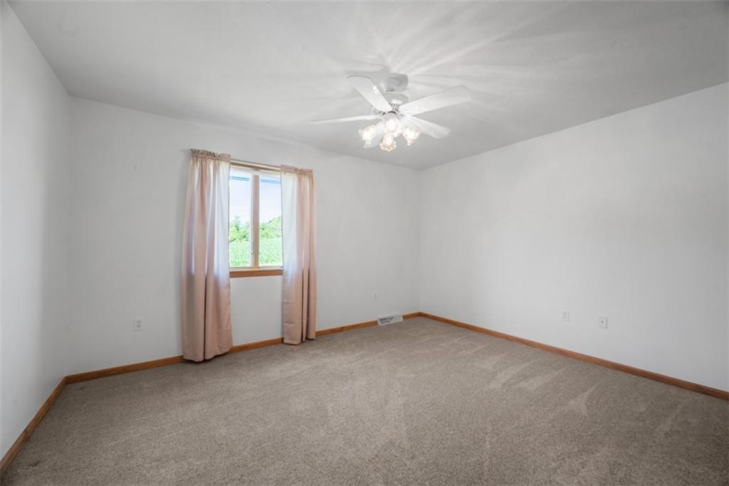 2812 Ridge Rd Extension Baden, PA 15005 - Photo 28 of 44 an empty room with a window and a fan