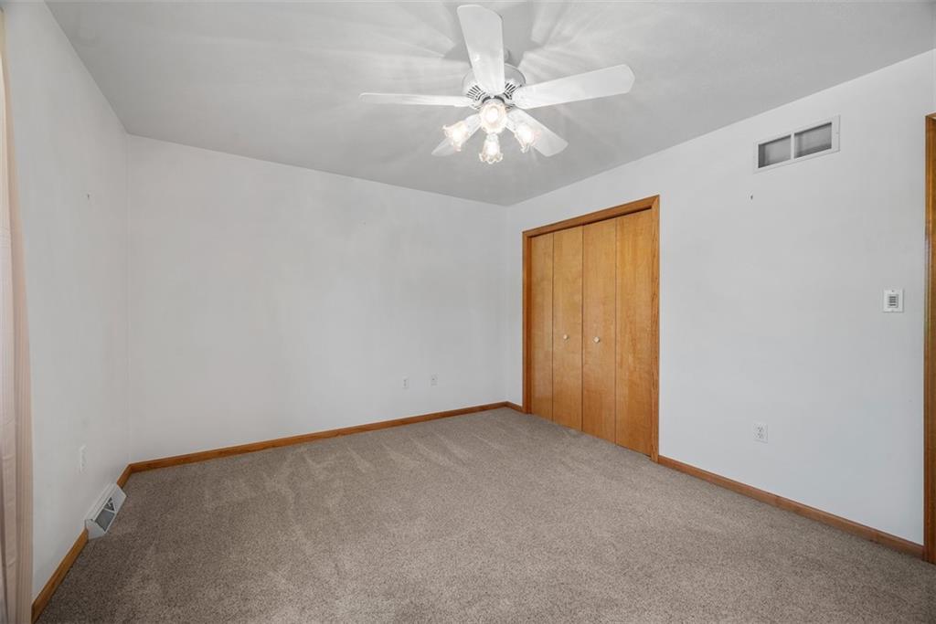 2812 Ridge Rd Extension Baden, PA 15005 - Photo 29 of 44 an empty room with windows and fan