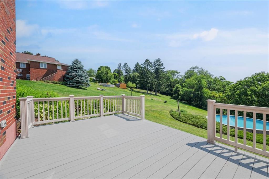 2812 Ridge Rd Extension Baden, PA 15005 - Photo 36 of 44 a view of a house with wooden deck and a big yard