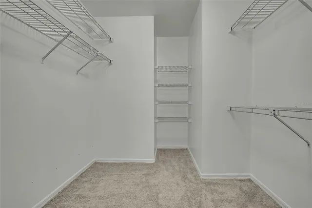 a view of a hallway with a chandelier