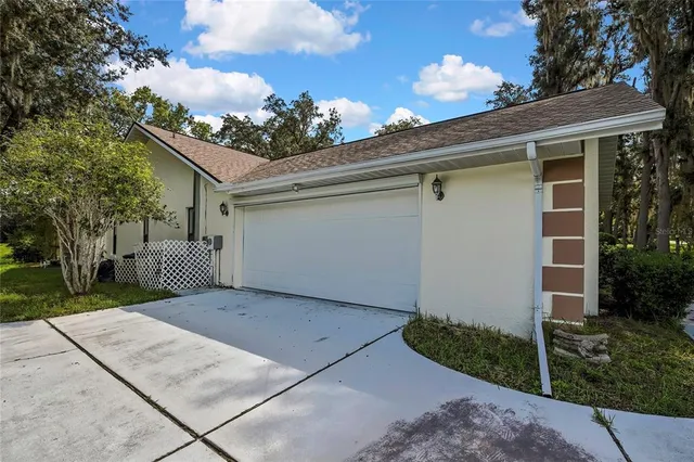 a backyard of a house with lots of green space