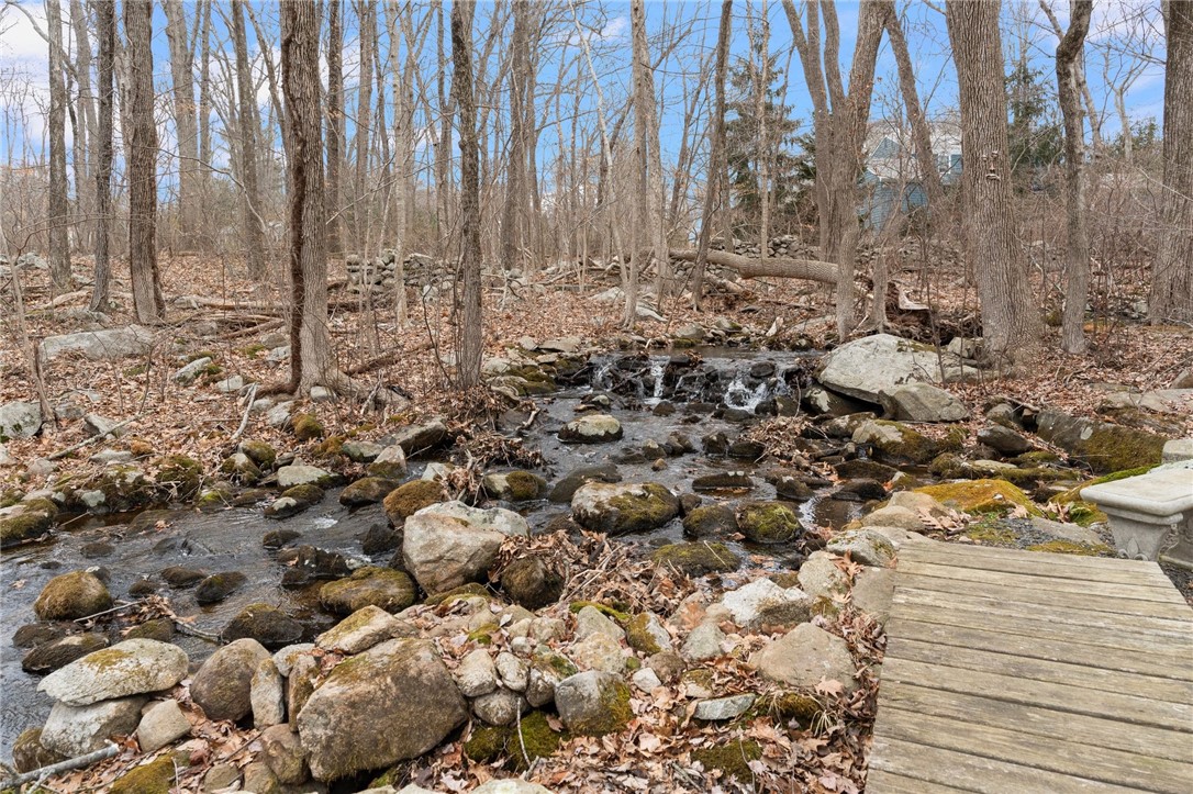8 Catherine Road Smithfield, RI 02917 - Photo 38 of 43 Stream in woods