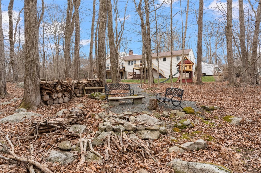 8 Catherine Road Smithfield, RI 02917 - Photo 39 of 43 Fire pit in woods