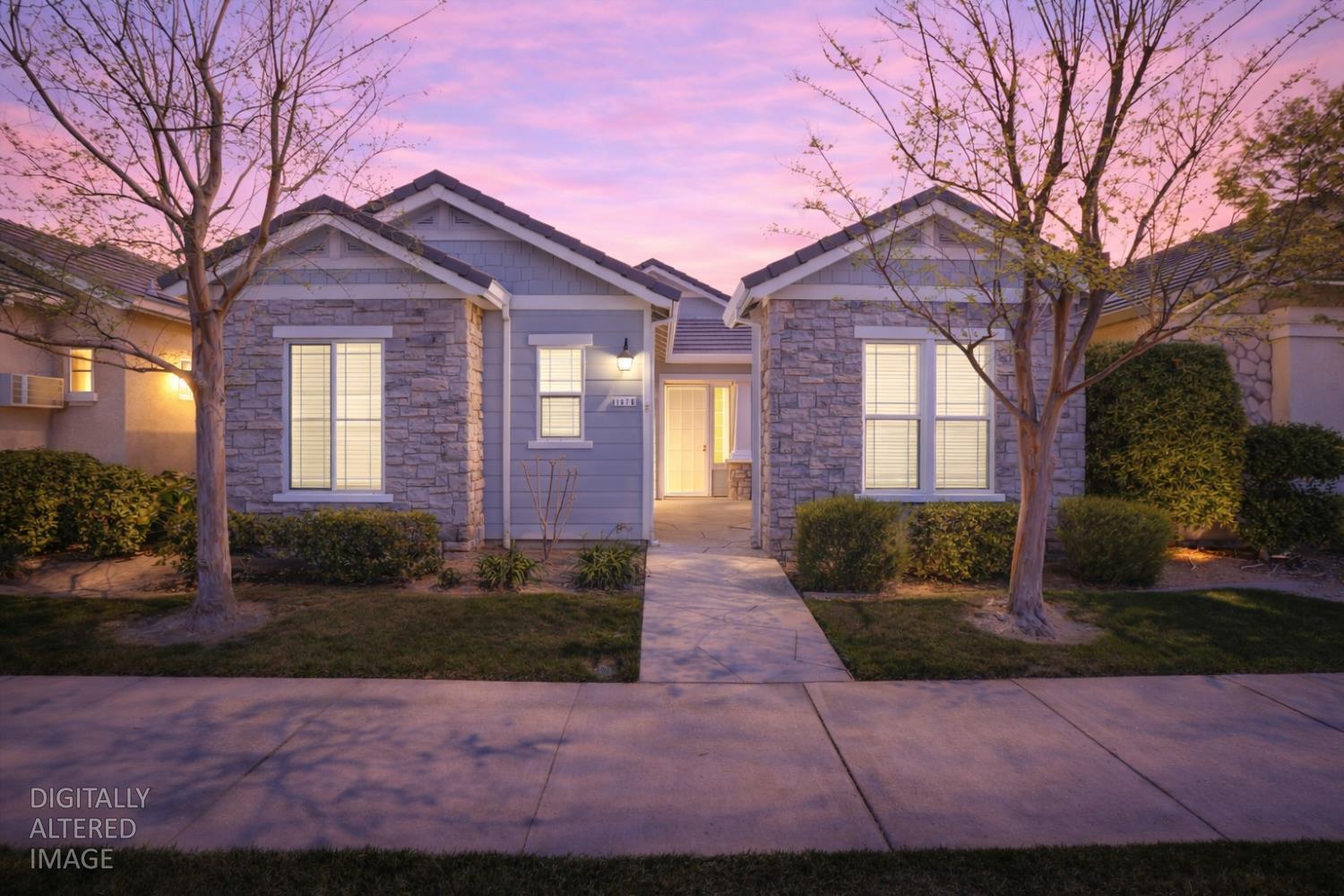 1678 Calhoun Avenue Ripon, CA 95366 - Photo 1 of 31 a front view of a house with a yard