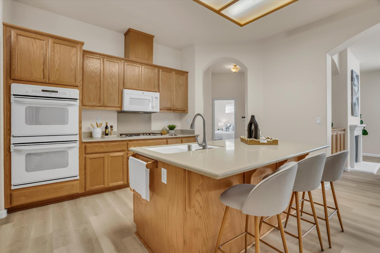 1678 Calhoun Avenue Ripon, CA 95366 - Photo 11 of 31 a kitchen with a sink stove and refrigerator