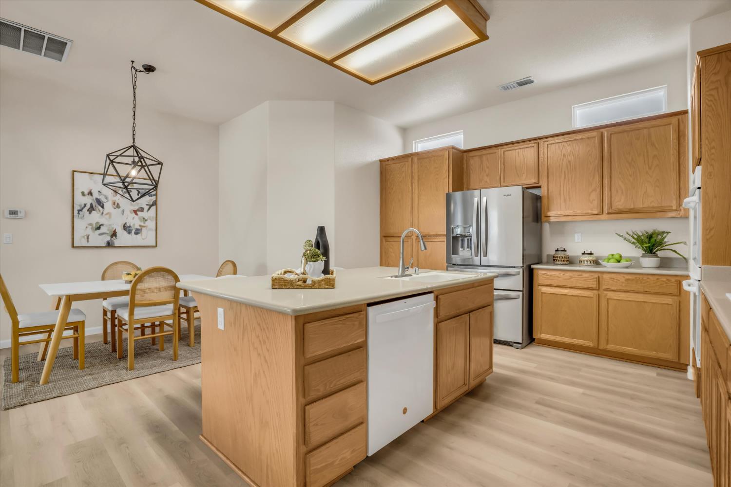 1678 Calhoun Avenue Ripon, CA 95366 - Photo 16 of 31 a kitchen that has a lot of cabinets a sink and a stove in it