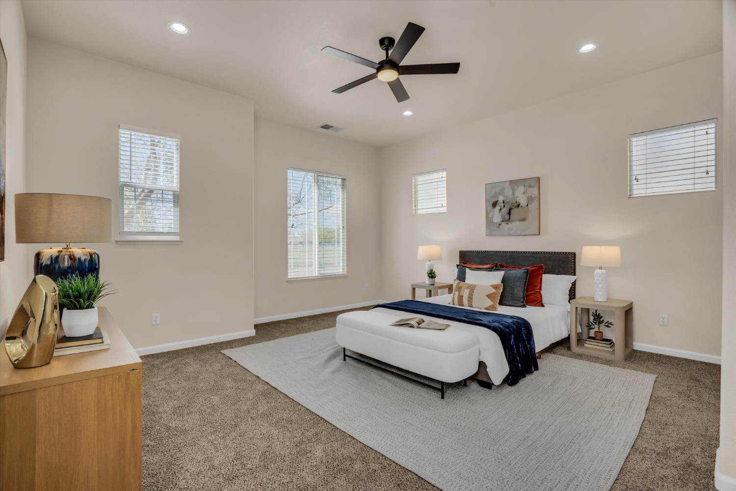 1678 Calhoun Avenue Ripon, CA 95366 - Photo 19 of 31 a bedroom with a bed a couch and a potted plant