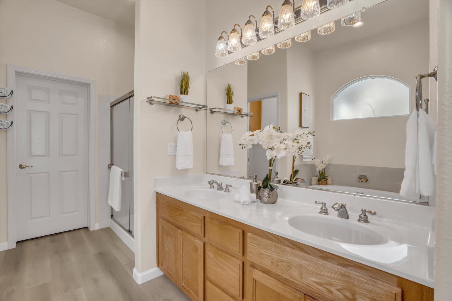 1678 Calhoun Avenue Ripon, CA 95366 - Photo 22 of 31 a spacious bathroom with a granite countertop sink mirror and a shower