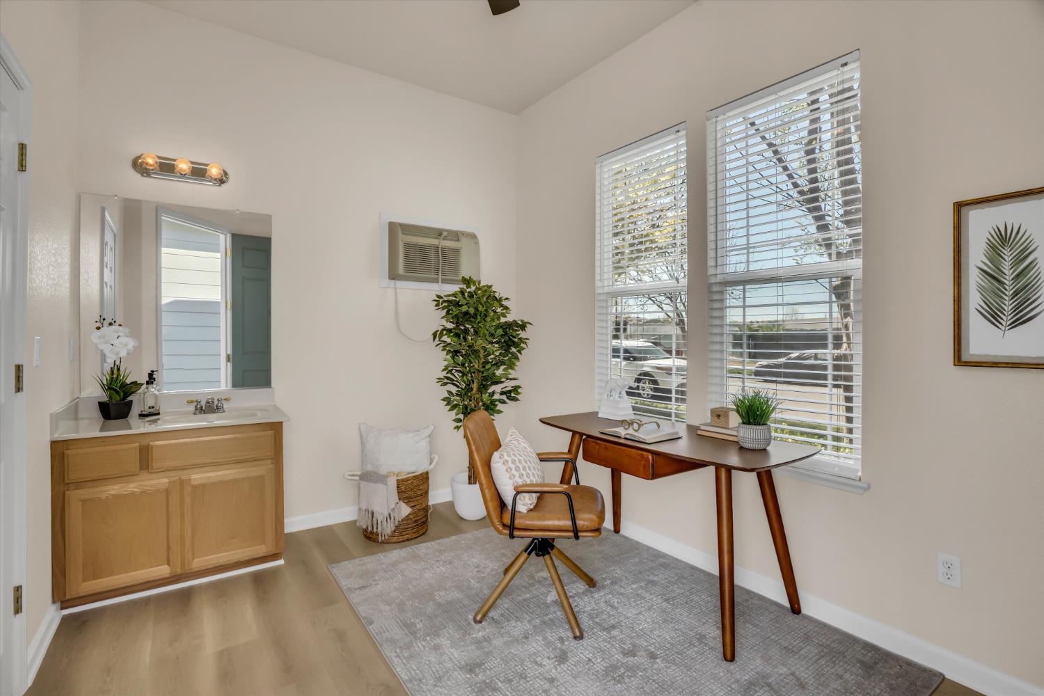 1678 Calhoun Avenue Ripon, CA 95366 - Photo 26 of 31 a view of a workspace with furniture and a window