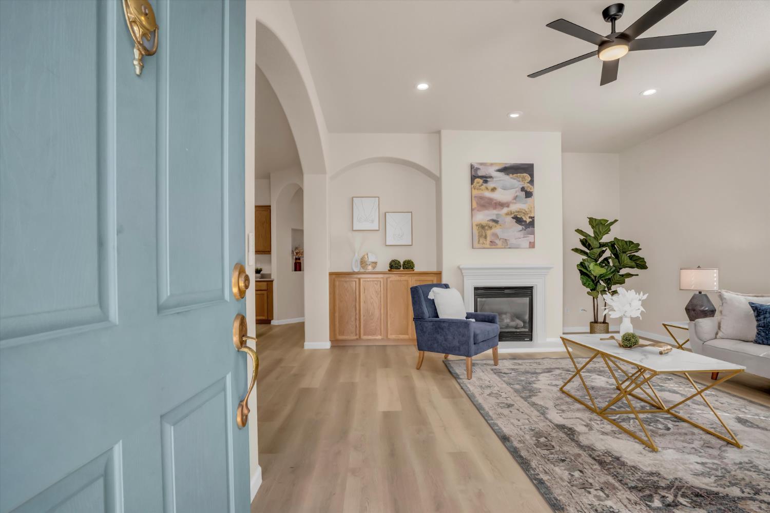 1678 Calhoun Avenue Ripon, CA 95366 - Photo 6 of 31 a living room with furniture and a fireplace
