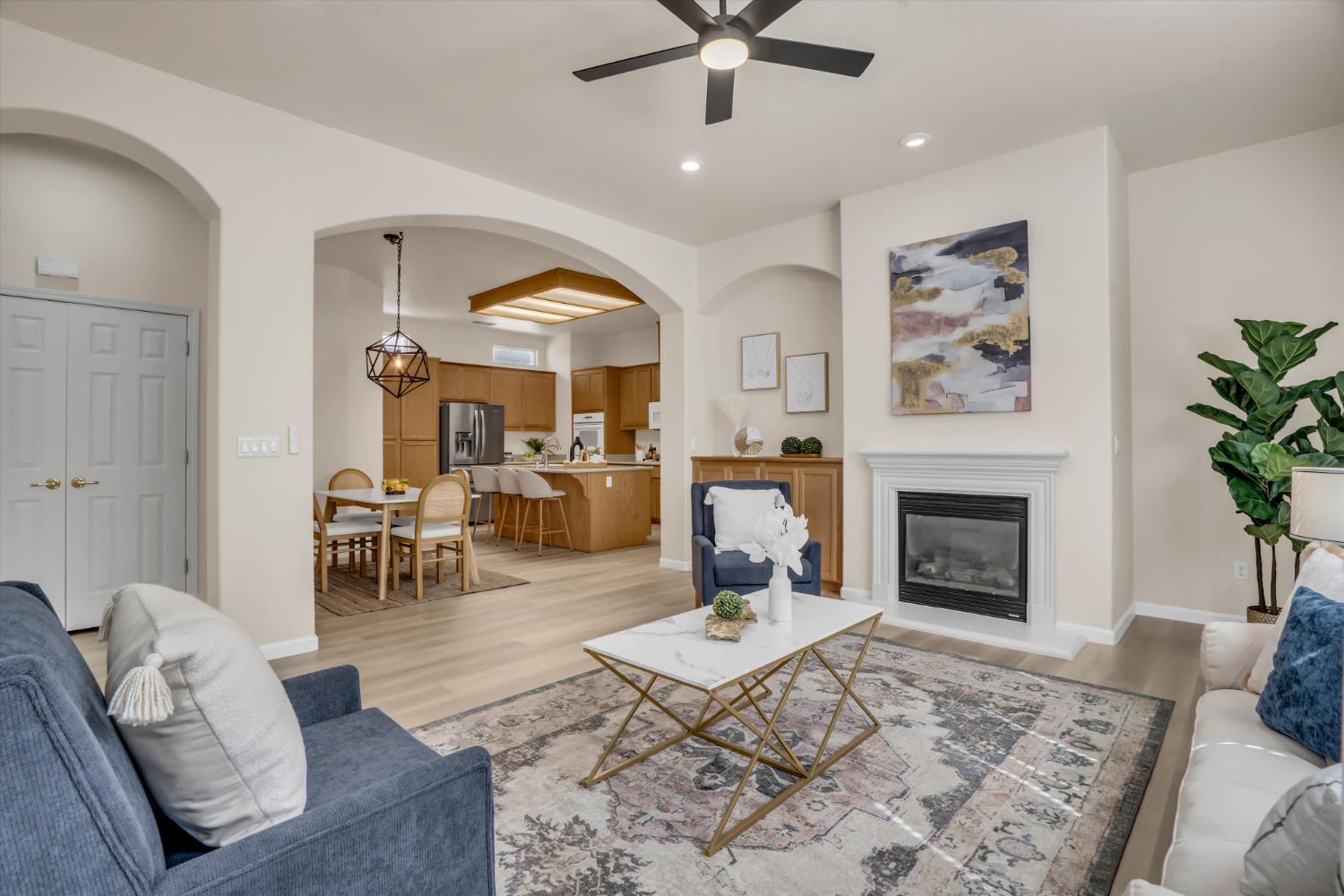 1678 Calhoun Avenue Ripon, CA 95366 - Photo 7 of 31 a living room with furniture and a fireplace