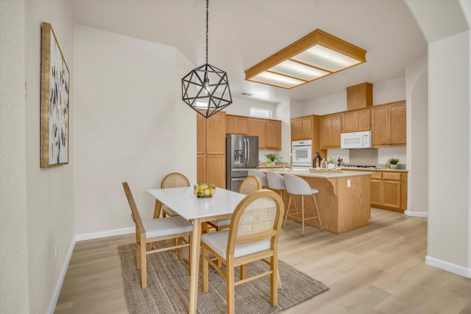 1678 Calhoun Avenue Ripon, CA 95366 - Photo 9 of 31 a view of a dining room with furniture and chandelier