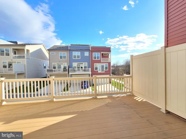 a view of a balcony with wooden floor