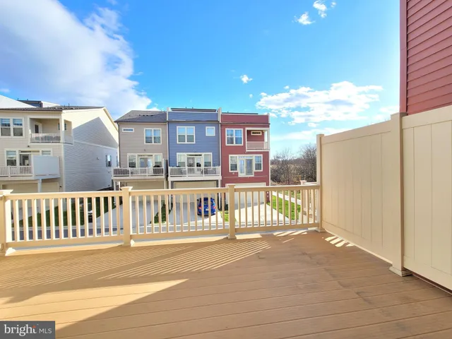 a view of a balcony with wooden floor