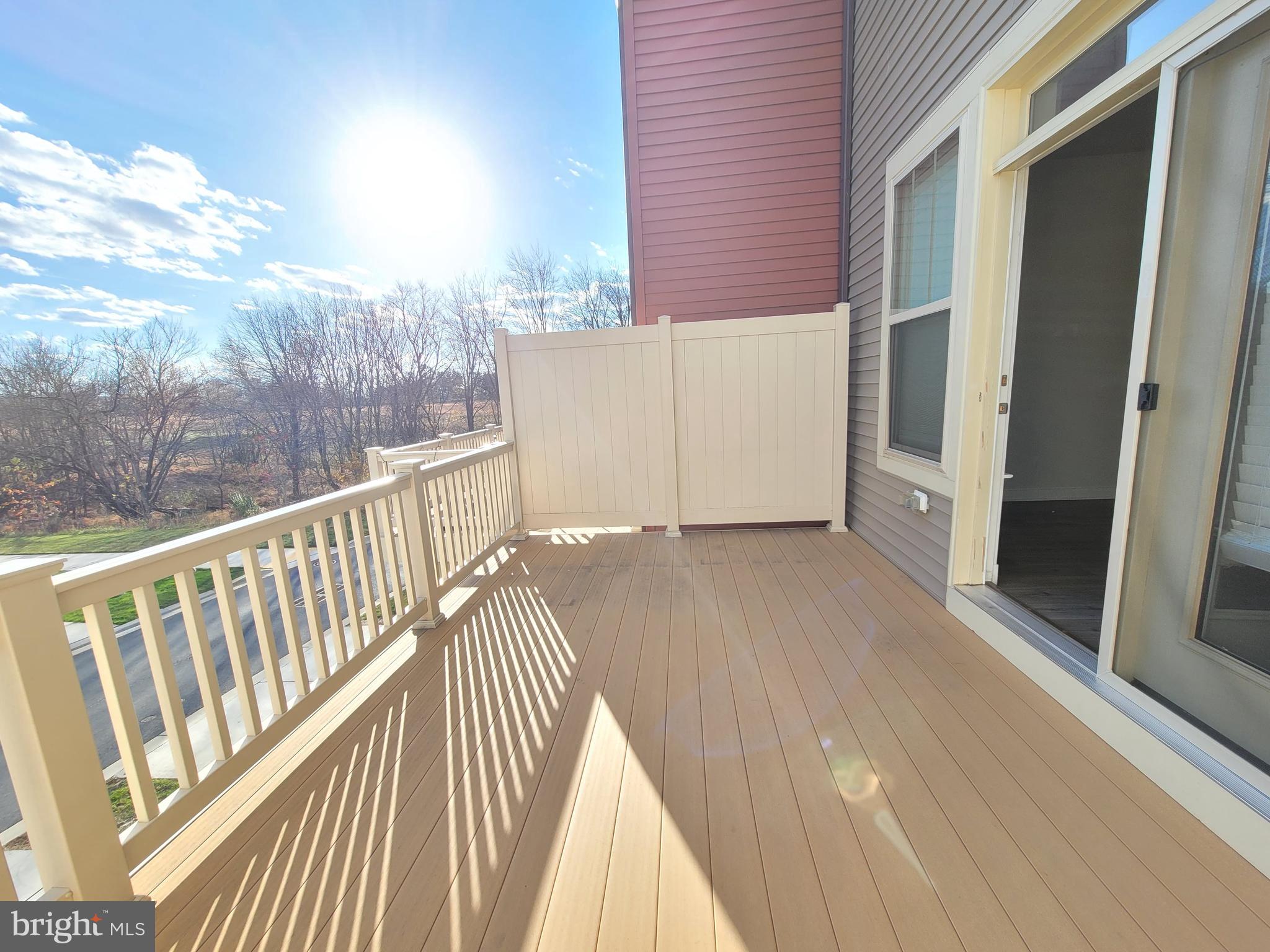8571 Red Sage Way South Frederick, MD 21704 - Photo 10 of 17 a view of a balcony with wooden floor