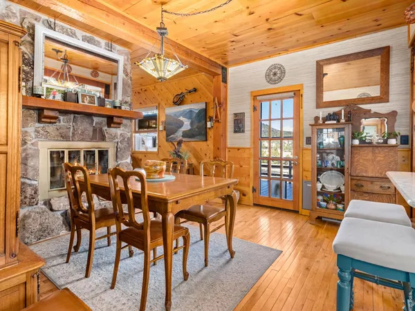 a bathroom with a sink and a bathtub next to a window