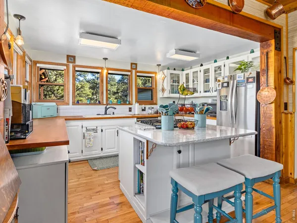 a view of a patio with dining table and chairs