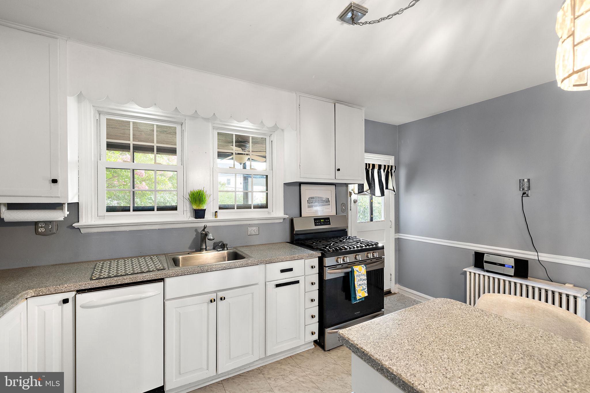 305 Troy Avenue Wilmington, DE 19804 - Photo 12 of 26 a kitchen with stainless steel appliances a sink stove and cabinets