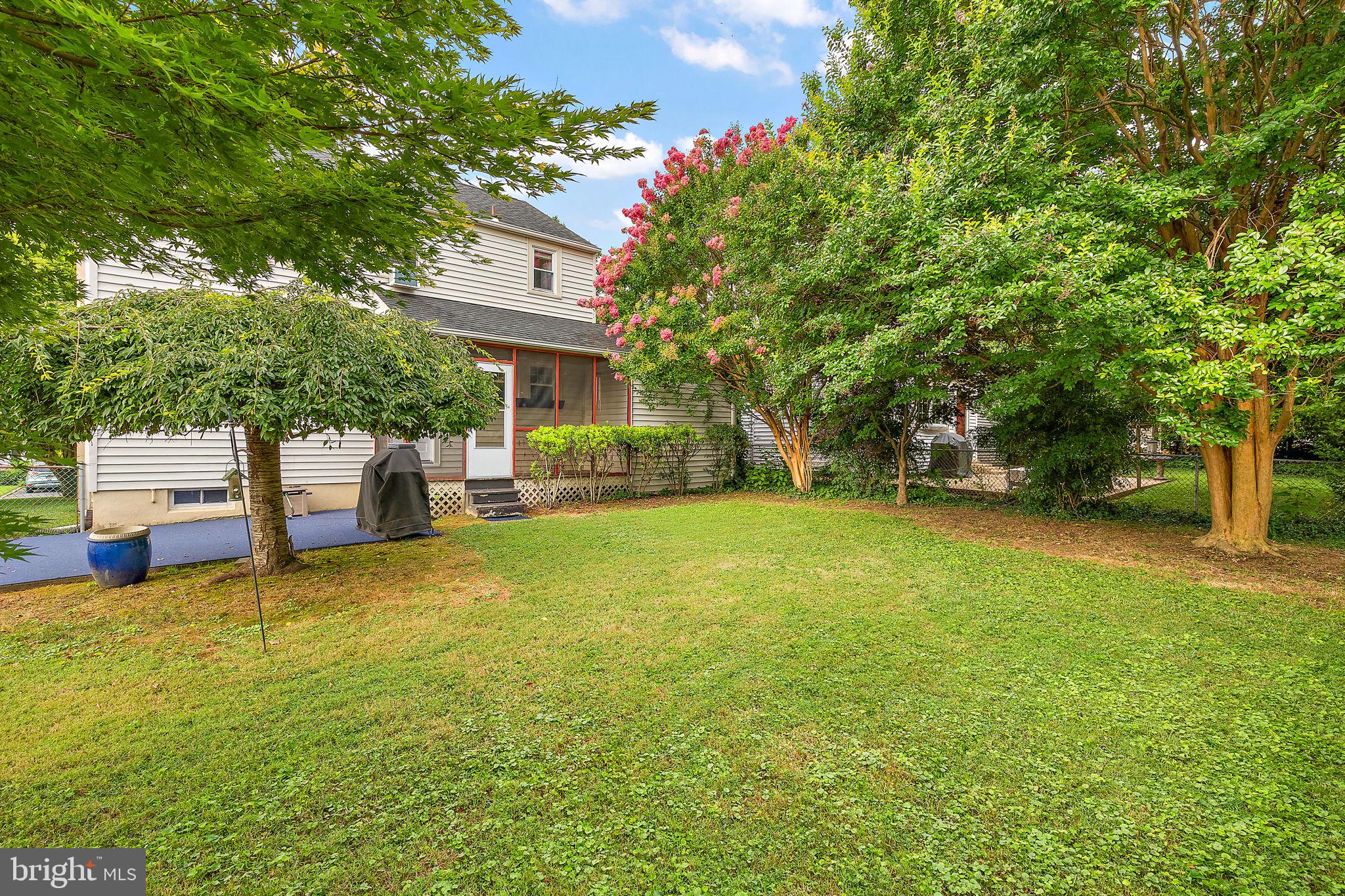 305 Troy Avenue Wilmington, DE 19804 - Photo 24 of 26 a view of a house with a big yard and large trees