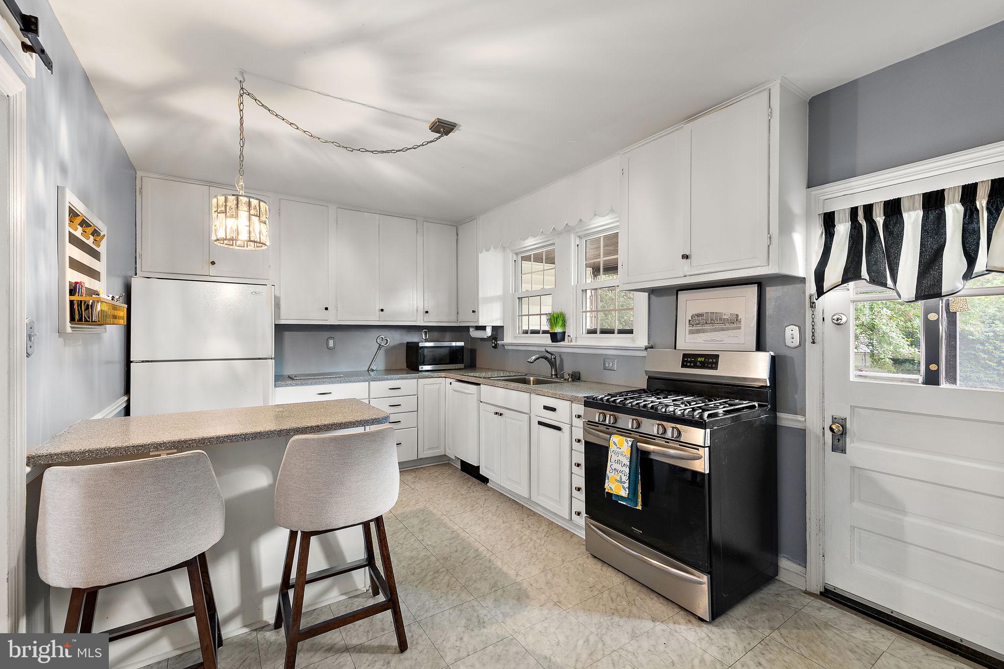 305 Troy Avenue Wilmington, DE 19804 - Photo 9 of 26 a kitchen with appliances cabinets and furniture