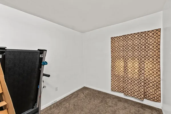 an empty room with wooden floor