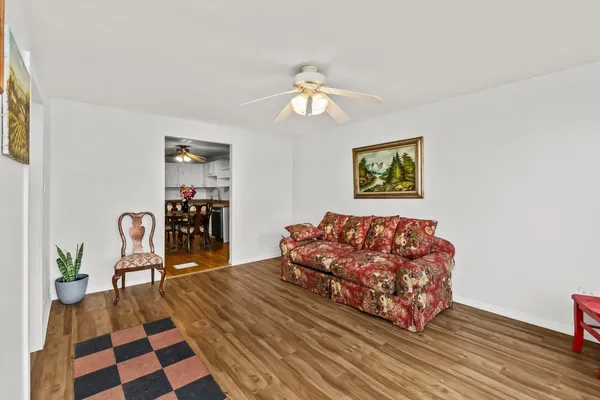 a living room with furniture and a rug