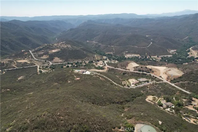 a view of a town with mountains in the background