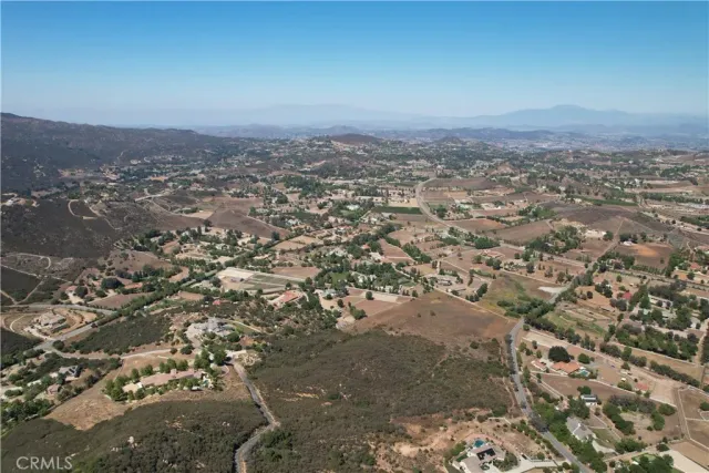 an aerial view of residential house and car parked