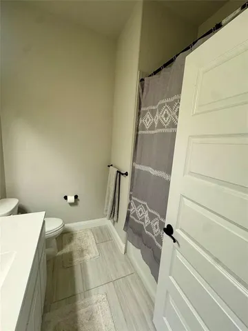 a bathroom with a bathtub and shower