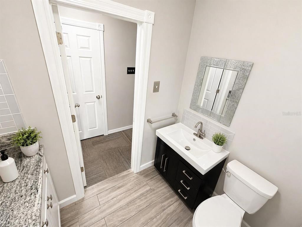 2313 Southeast 7th Street Ocala, FL 34471 - Photo 26 of 54 a bathroom with a sink toilet and tub