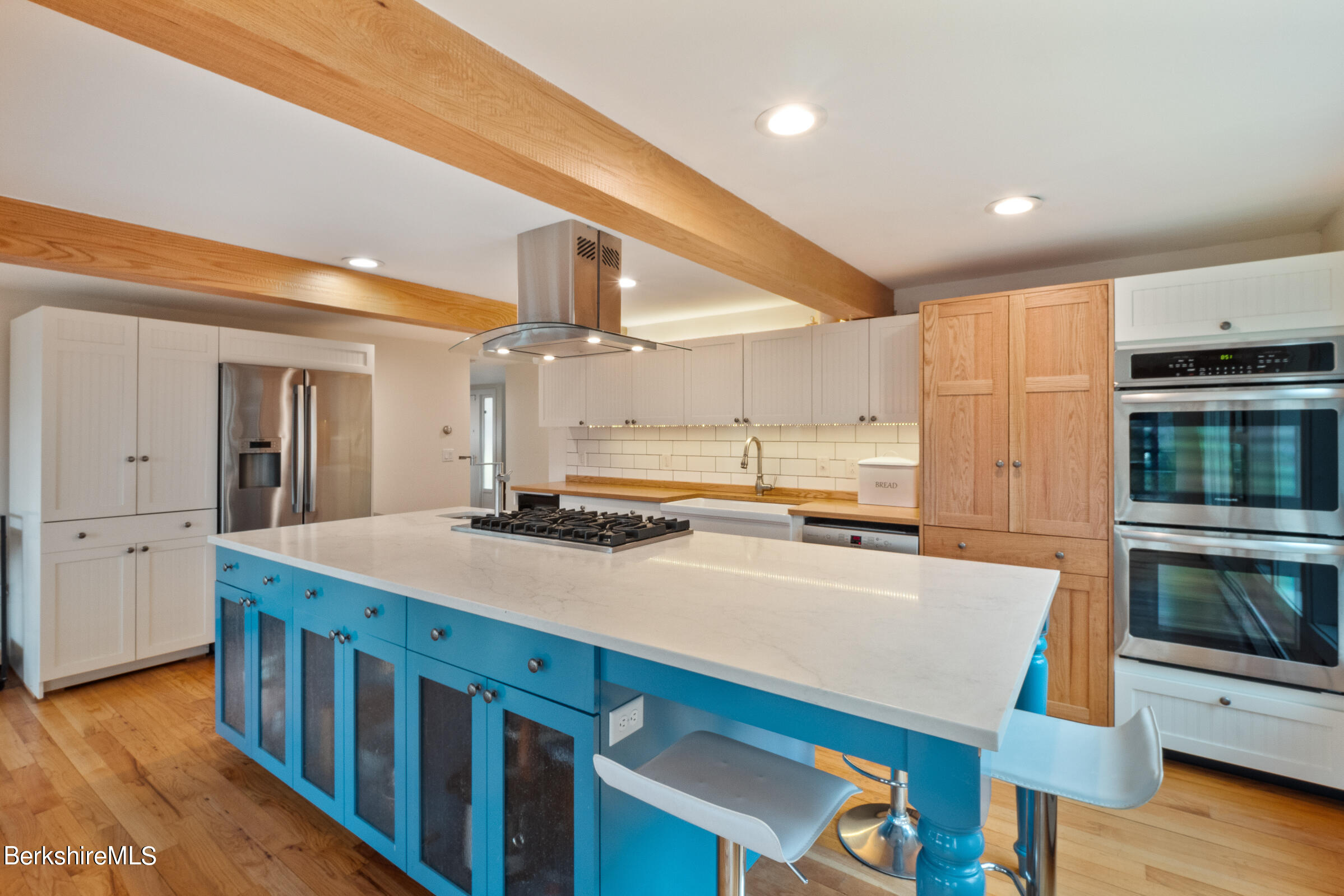 605 Main Road Monterey, MA 01245 - Photo 17 of 40 a kitchen with stainless steel appliances sink stove microwave and cabinets