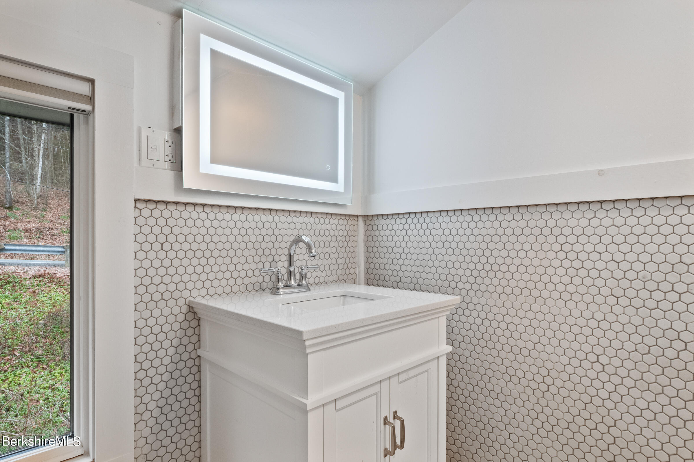 605 Main Road Monterey, MA 01245 - Photo 27 of 40 a bathroom with a sink a toilet and mirror