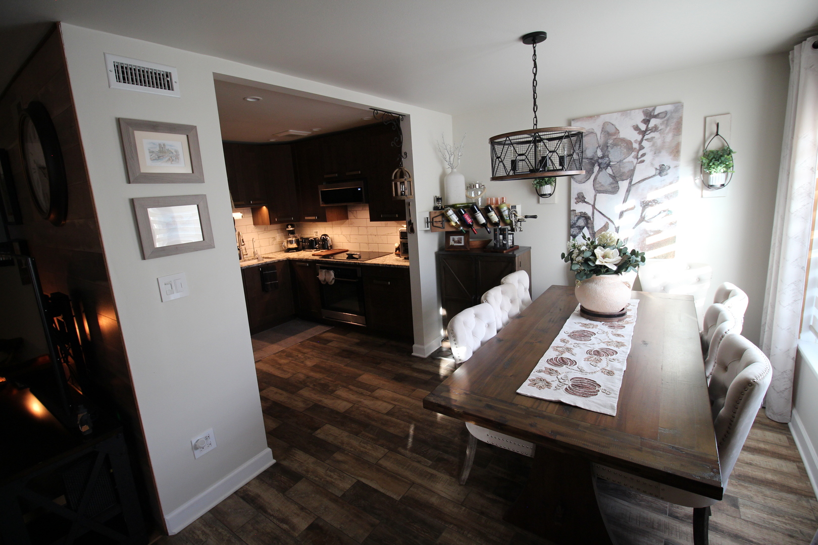 1700 Robin Lane, Unit 1D Hoffman Estates, IL 60169 - Photo 12 of 18 a view of a dining room with furniture window and wooden floor