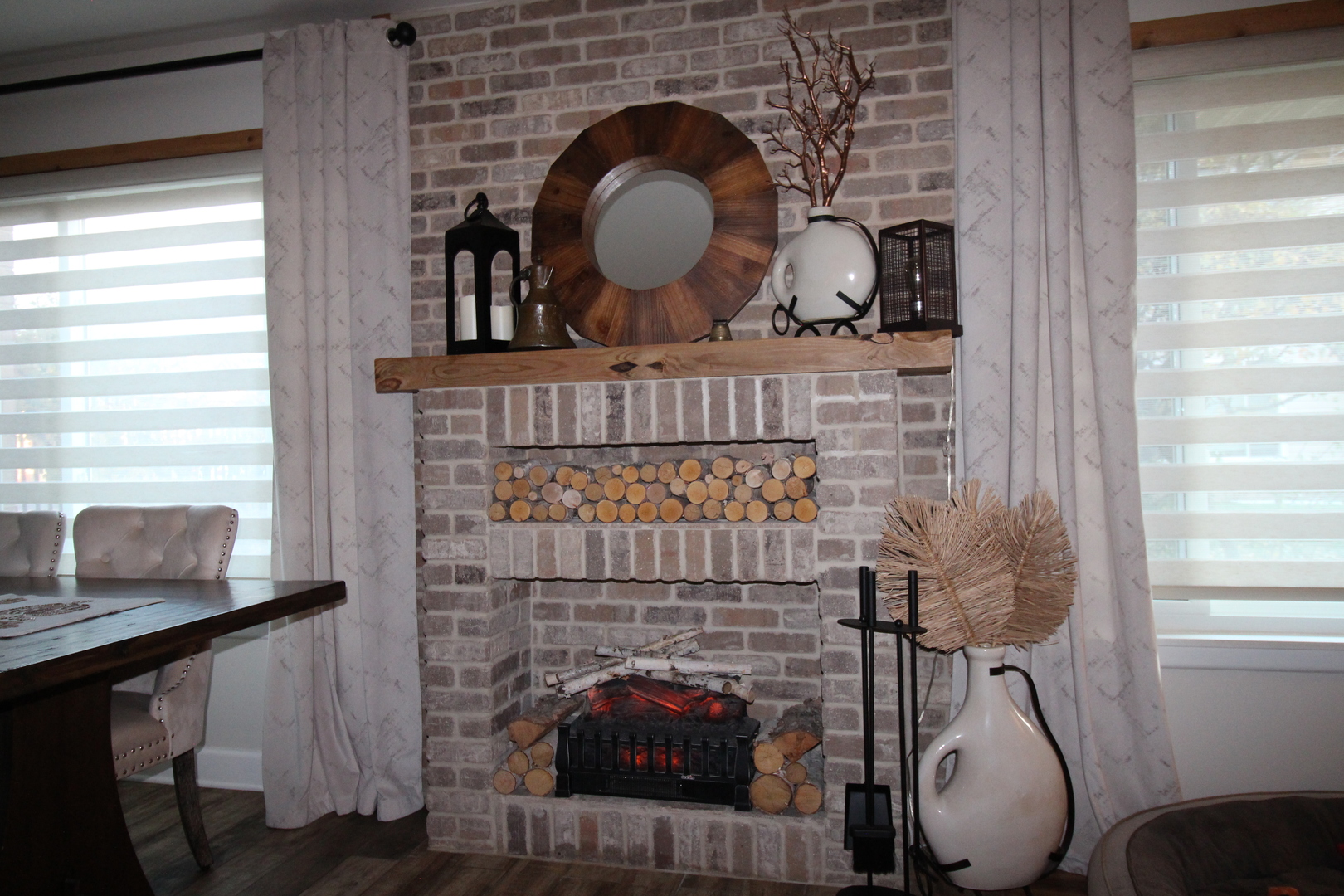 1700 Robin Lane, Unit 1D Hoffman Estates, IL 60169 - Photo 13 of 18 a living room with furniture and a fireplace
