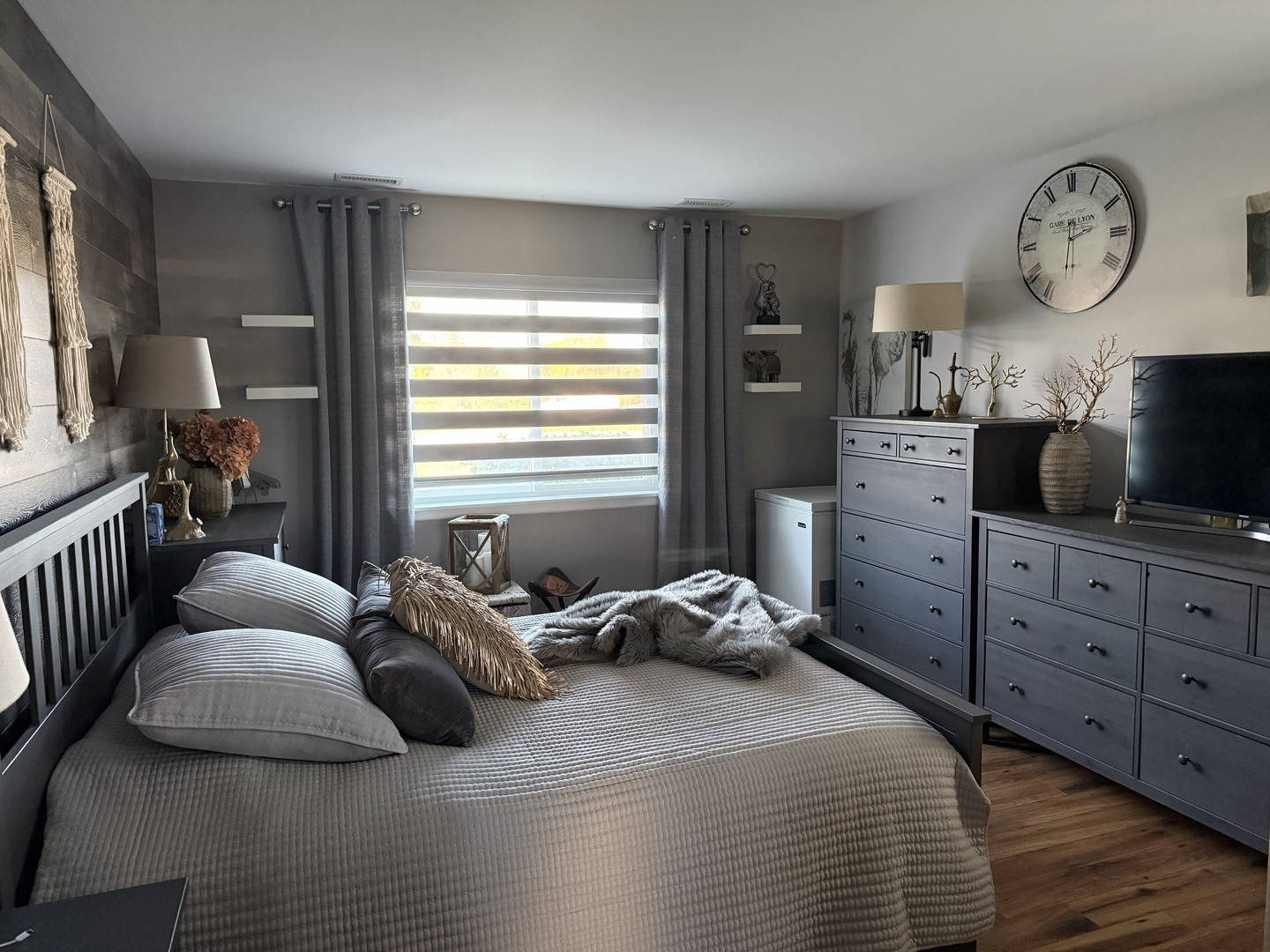 1700 Robin Lane, Unit 1D Hoffman Estates, IL 60169 - Photo 17 of 18 a bedroom with a bed a mirror and a window