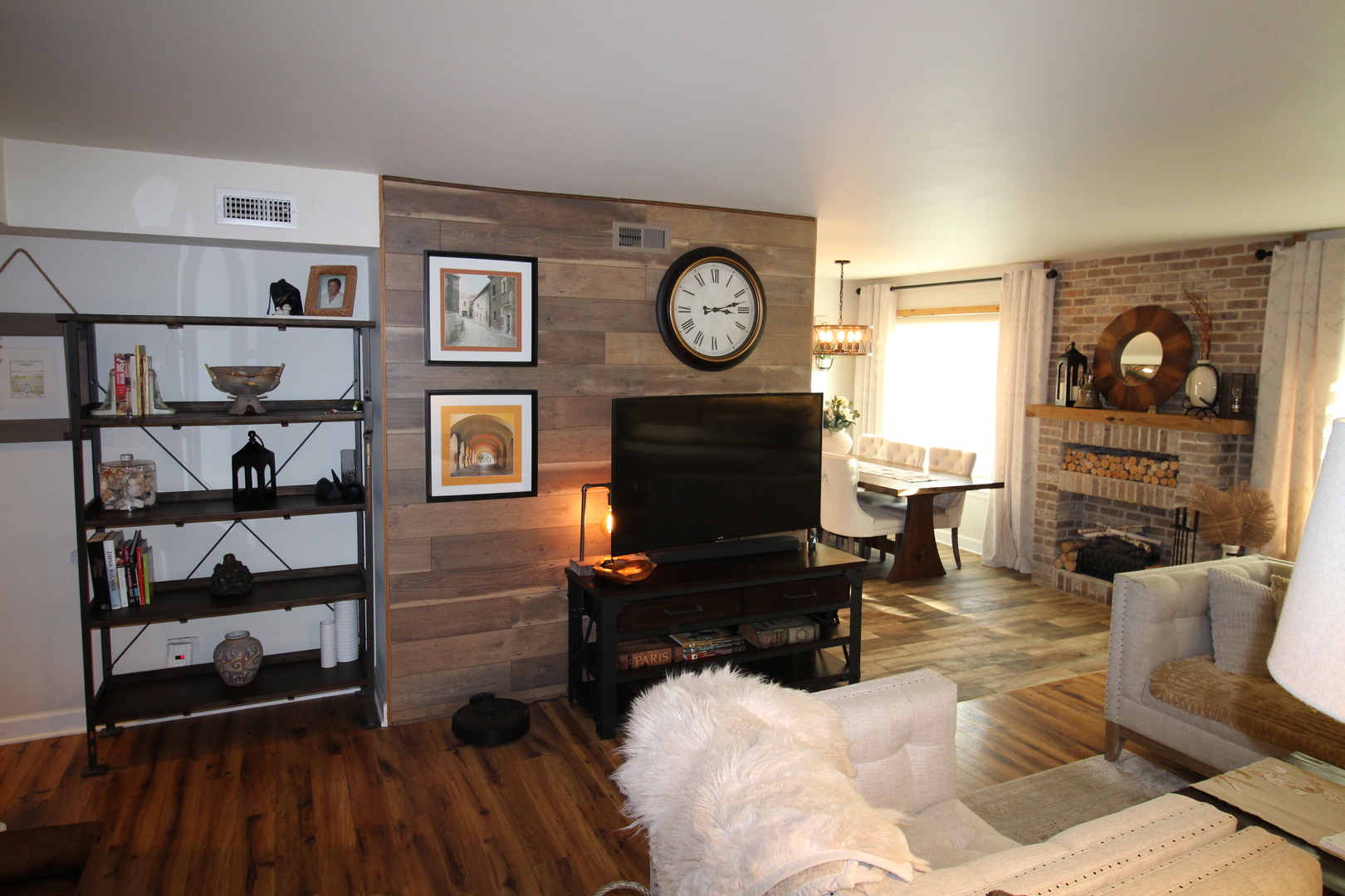 1700 Robin Lane, Unit 1D Hoffman Estates, IL 60169 - Photo 4 of 18 a living room with furniture and a fireplace