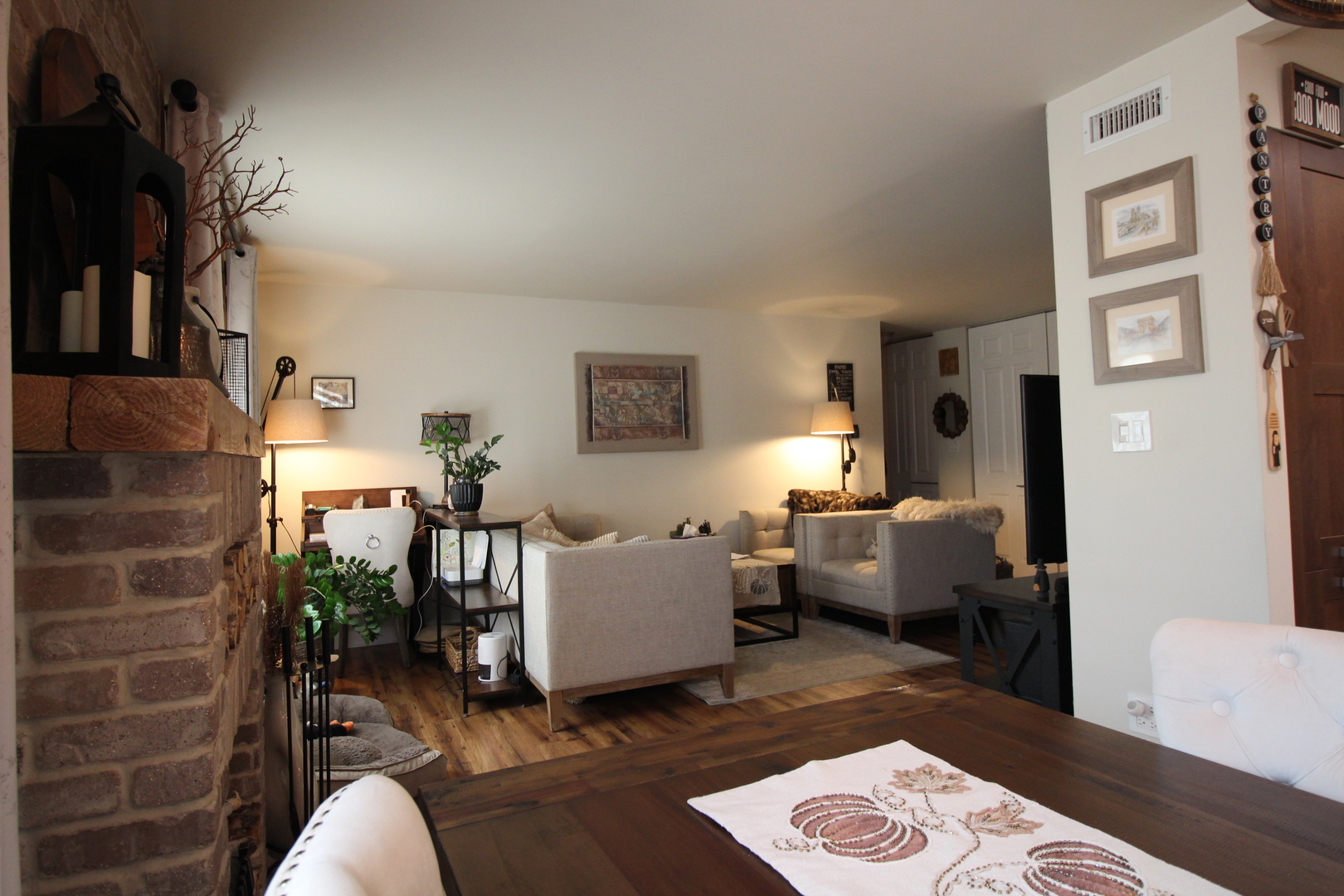1700 Robin Lane, Unit 1D Hoffman Estates, IL 60169 - Photo 5 of 18 a living room with furniture rug and wooden floor