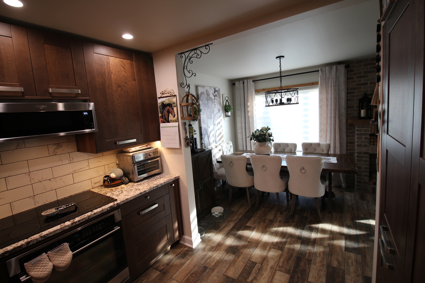 1700 Robin Lane, Unit 1D Hoffman Estates, IL 60169 - Photo 8 of 18 a kitchen with a sink appliances and cabinets