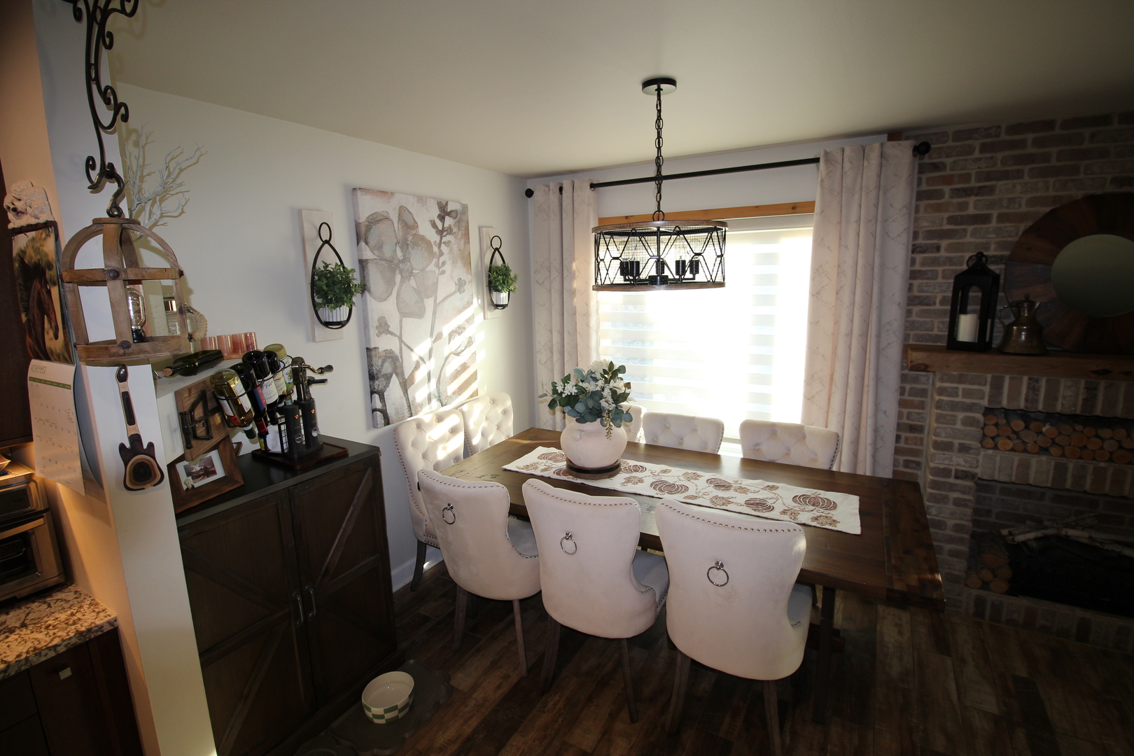 1700 Robin Lane, Unit 1D Hoffman Estates, IL 60169 - Photo 10 of 18 a view of a dining room with furniture window and wooden floor